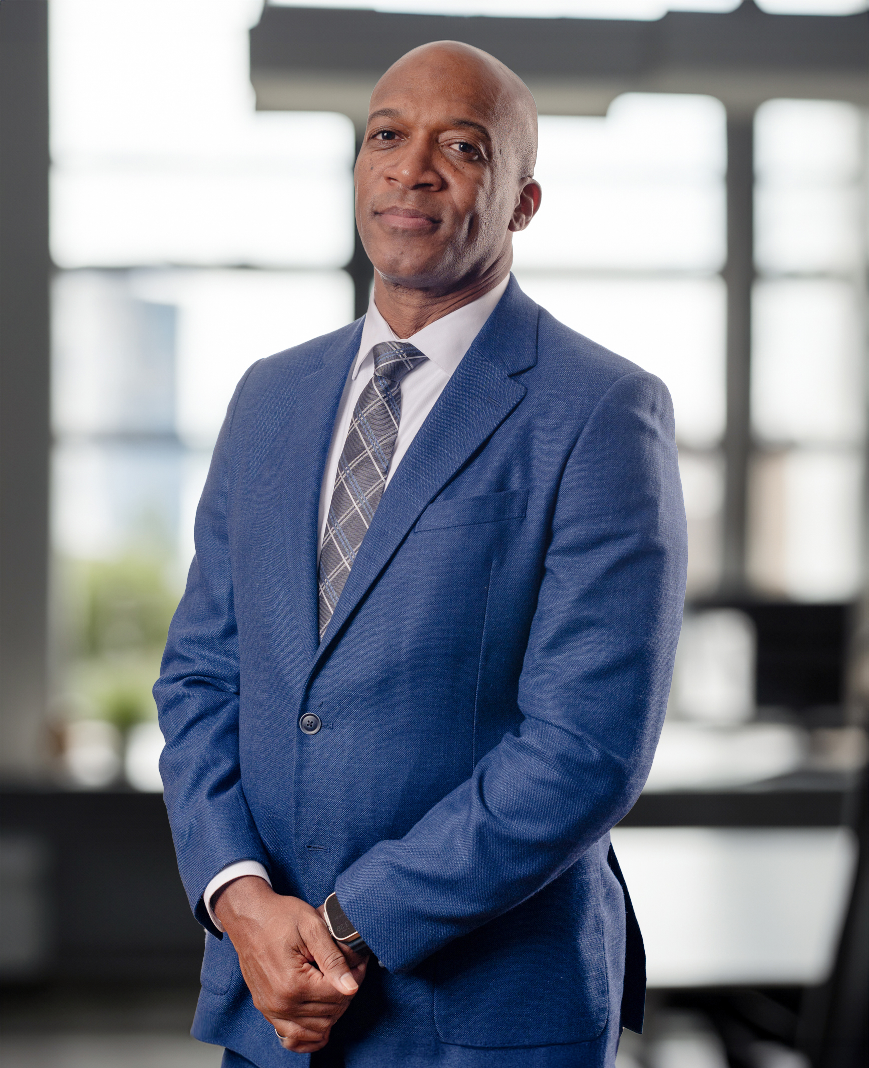 Professional corporate headshot in an office setting